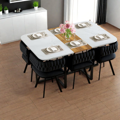 Ensemble de table de salle à manger en marbre et en bois compact avec chaises en velours, idéal pour les maisons modernes