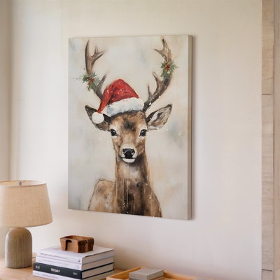 Toile, un charmant portrait fantaisiste d'un cerf avec de grands yeux d'art mural ornés d'un chapeau de père Noël rouge festif
