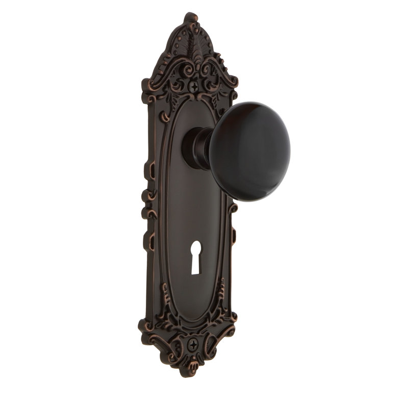 Victorian Plate with Decorative Keyhole and Black Porcelain Door Knob, Timeless Bronze, 2-3/4”