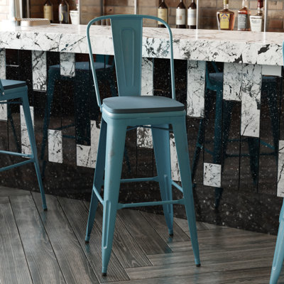 Tabouret à hauteur de comptoir toutes saisons avec siège en résine polyester Brinya