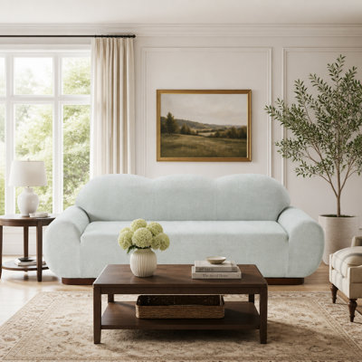 Canapé trois places moderne incurvé en tissu bouclé, avec un design en forme de nuage et des coussins en mousse haute densité