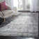 Riebe Abstract Black/Silver Area Rug