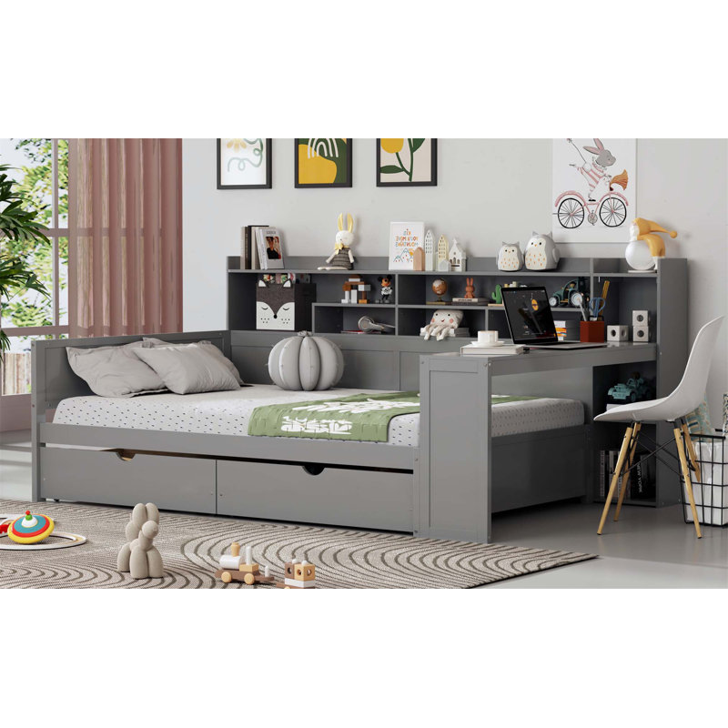 Lit de jour pleine grandeur en bois avec lit gigogne, tiroirs de rangement et bureau d'étude pour une utilisation multifonctionnelle peu encombrante.