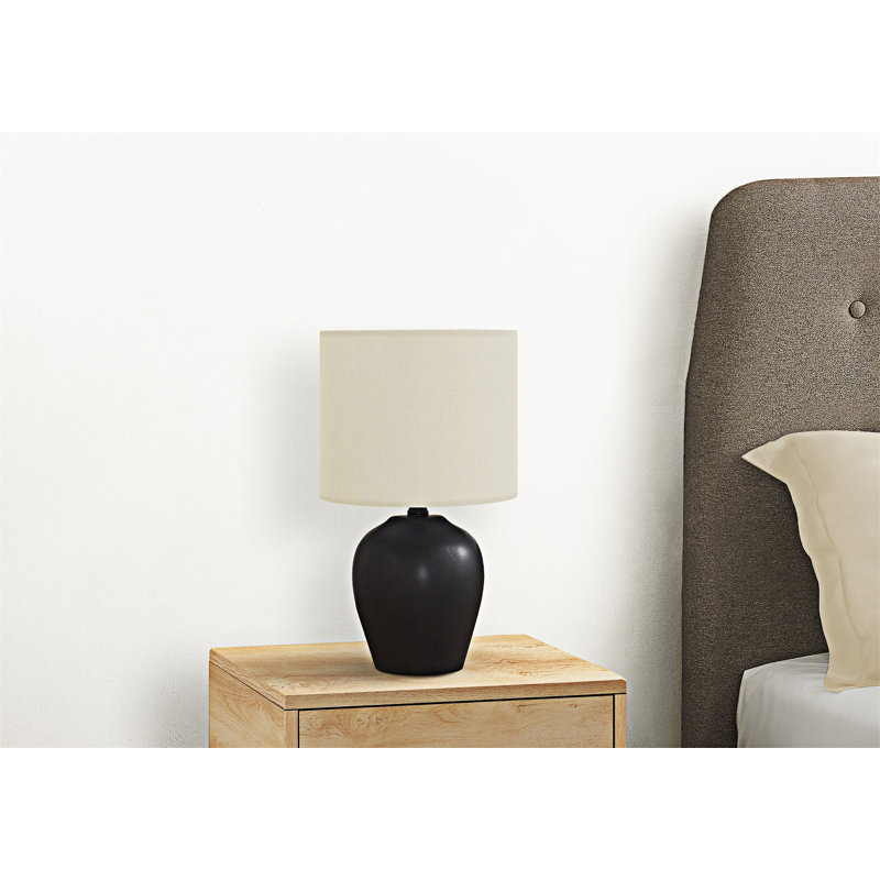 Lampe de table en céramique noire lisse avec abat-jour en tissu ivoire
