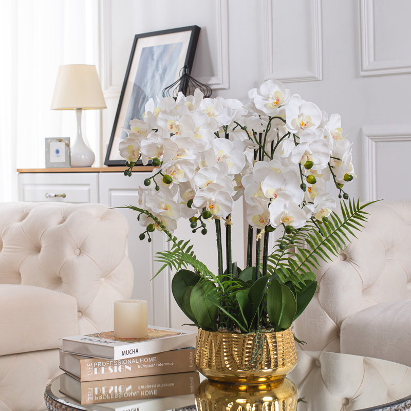Arrangement floral faux orchidée phalaenopsis dans un vase en céramique