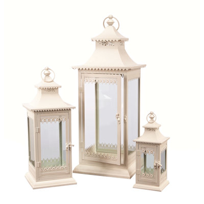 Ensemble de trois bougeoirs de lanterne ornés de verre ivoire et de métal