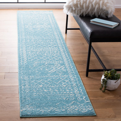 Tapis turquoise / ivoire Strobel