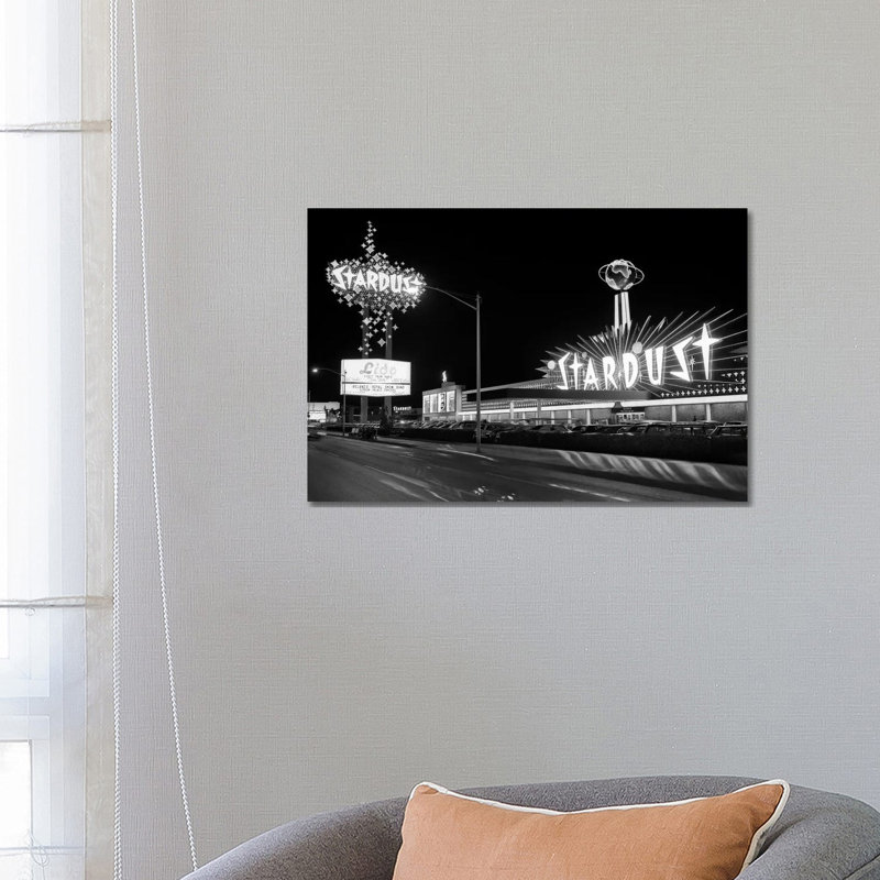 1960s Night Scene Of The Stardust Casino Las Vegas Nevada USA by Vintage Images - Wrapped Canvas Print