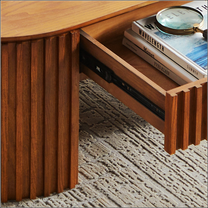 Table basse Mid-Century moderne en bois ovale avec tiroir spacieux, idéale pour un décor de salon élégant et fonctionnel.