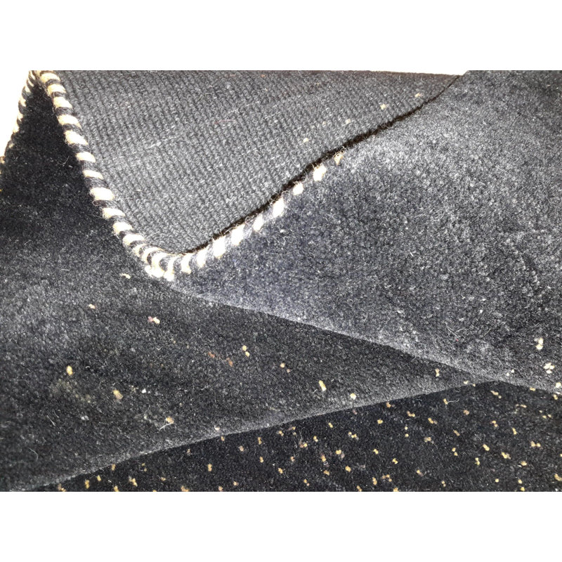 Ovide Polka Dots Area Rug in Black