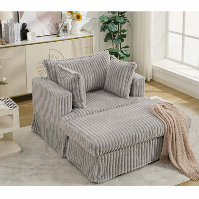 Fauteuil en velours côtelé avec repose-pieds