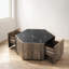 Table basse avec tiroirs dissimulés, panneau de fibres à densité moyenne noir mat et finition chêne brun clair, forme hexagonale pour le salon et les espaces de réception