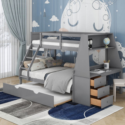 Lit simple superposé au dessus d'un lit double avec lit gigogne et bureau
