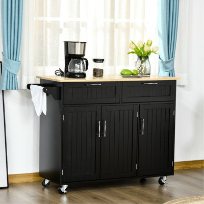 Chariot d'îlot de cuisine mobile avec plateau en bois - noir. Tiroirs, armoires à 3 portes, porte-serviettes. Développer l'espace de travail. Gain de place. Facile à déplacer. Look moderne. Surface l 43,7 po x l 18,1 po. Capacité de 110 lb. Assemblage
