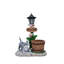Jardinière en forme de chat allongé avec lumière DEL intégrée et surface de plantation fonctionnelle pour l'ambiance extérieure et la verdure.