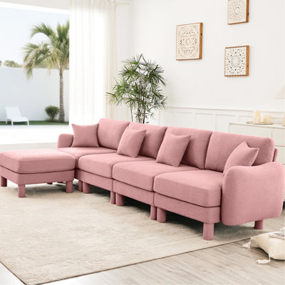 Tissu convertible en L rose à 4 places convertible avec pieds en forme de coquillage, amovibles et cylindriques. Siège moderne de conception moderne pour vous détendre à votre place