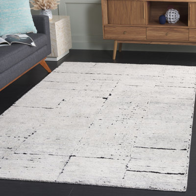 Anindita Hand Tufted Wool/Cotton Rug in Black/Ivory