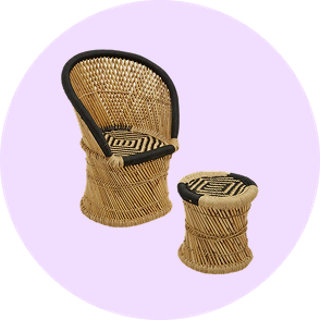 Woven rattan peacock chair and stool on lilac background
