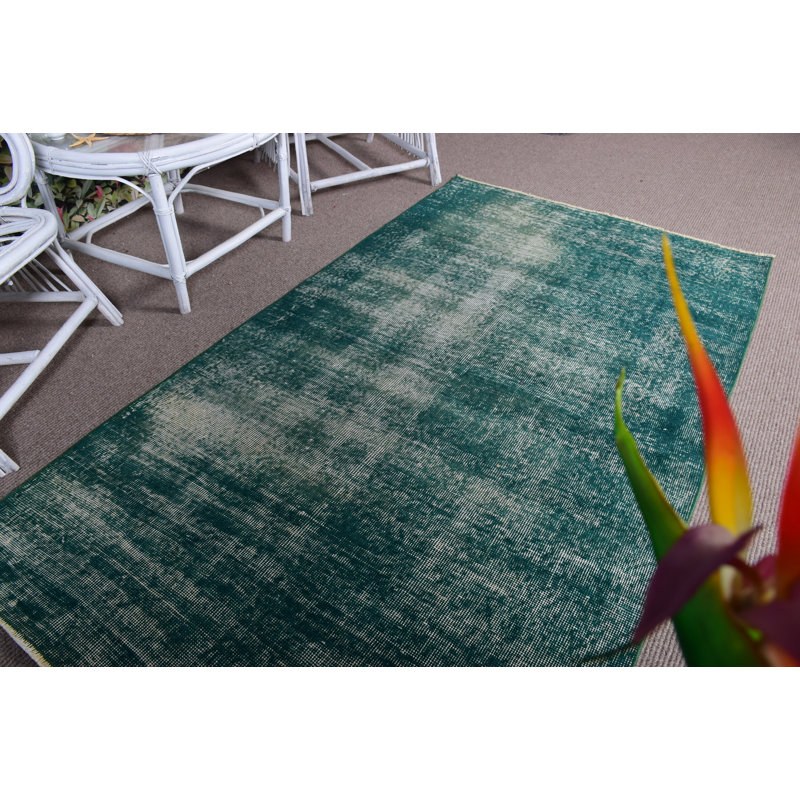 Tapis turc à motif rétro vert idéal pour décorer le salon
