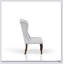 Luxueux fauteuil à oreilles rembourré avec coussins moelleux et design classique pour une assise confortable et un décor élégant