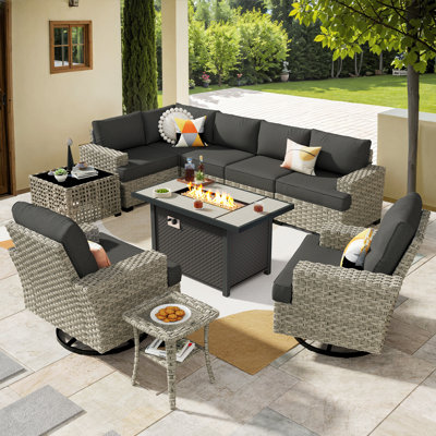 7- Person Rattan Outdoor Seating Group With Swivel Rockers and Fire Pit Table