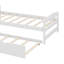 Un lit plateforme simple accompagné d'un lit gigogne sous le lit simple-274311417