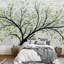 Papier peint arbre avec feuilles vertes sur une brique-93996846
