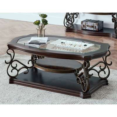 Table de cocktail en brun foncé, avec surface en verre et rangement, pieds en métal