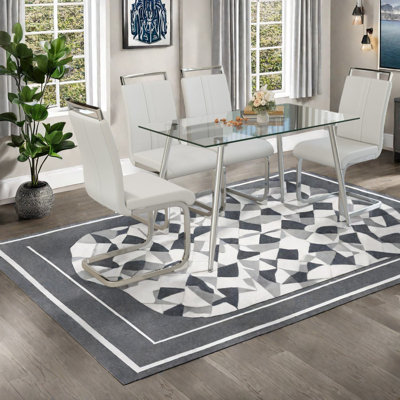 Modern Glass Dining Table Set With Silver Legs And Comfortable Chairs