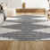 Tapis blanc / gris à poils longs à rayures géométriques Collenn