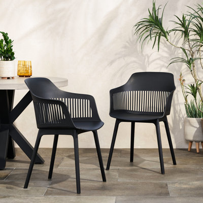 Sièges d'extérieur Dahlia: option météo et classe. Chaise en polypropylène noir de 22,5 po x 21,5 po x 33,5 po de style contemporain. Polypropylène, X 33 po