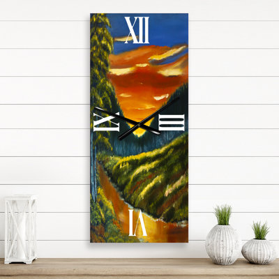 Horloge murale Warm Sunset Over the Lotus Swamp