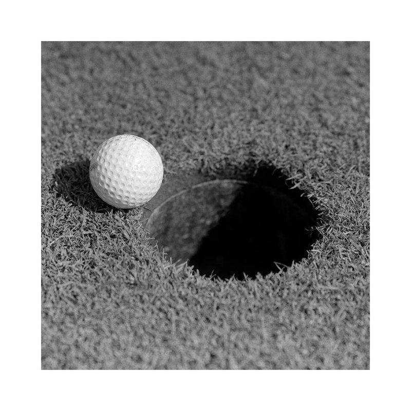 1950s Close-up Of Golf Ball On Green On Very Edge Of Cup by Vintage Images - Wrapped Canvas Print