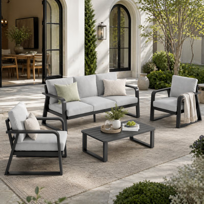 Ensemble de mobilier d'extérieur moderne en aluminium avec canapé, chaises, table basse et coussins