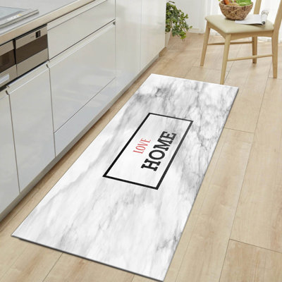 Tapis en jute tissé à la machine en noir / blanc / gris