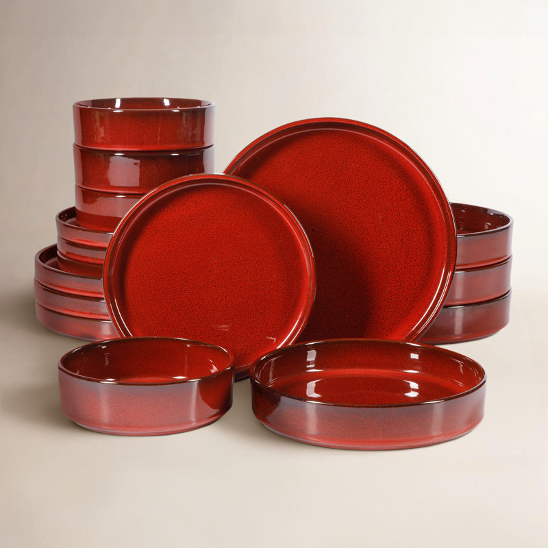 Santorini 16-piece terracotta dinnerware set in garnet red with a speckled reactive glaze finish.