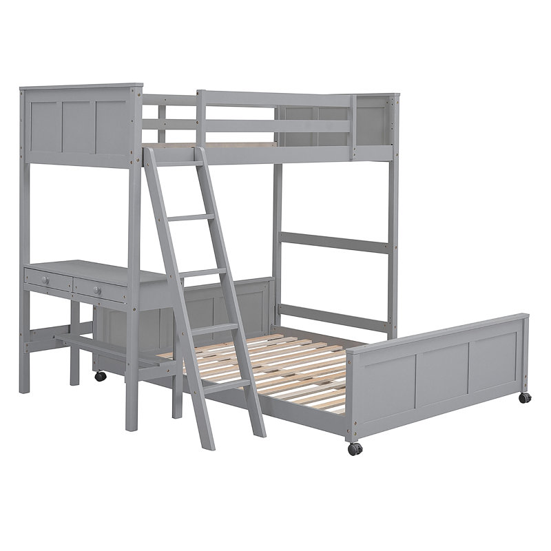 Lit simple superposé au dessus d'un lit double avec bureau