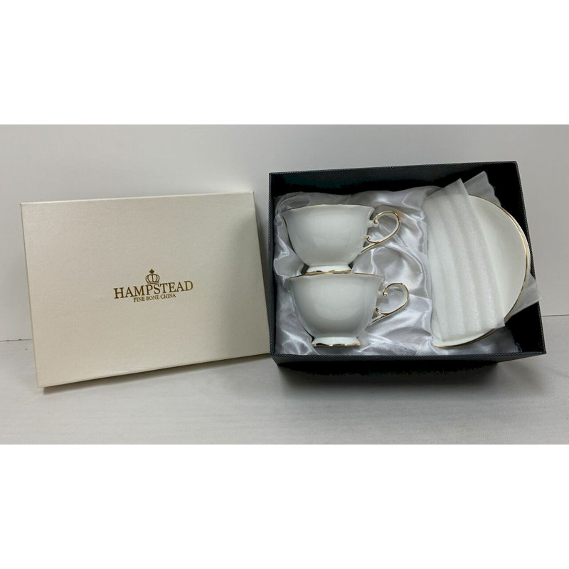 Ensemble de 2 tasses à thé blanches avec garniture dorée