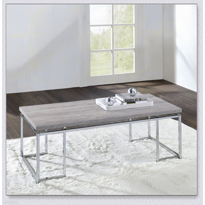 Table basse en chêne naturel moderne avec base en métal chromé pour un salon élégant