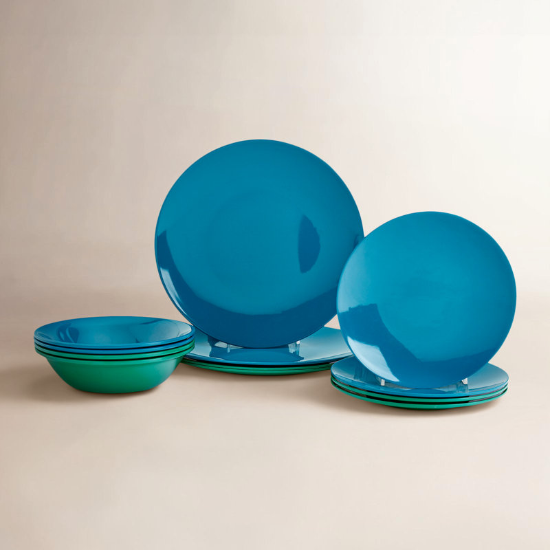 12-piece melamine dinnerware set in teal, featuring stacked dinner plates, salad plates, and bowls.