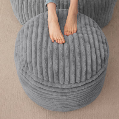 Pouf rond en velours côtelé à rayures