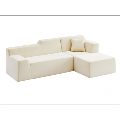 Canapé à dossier haut en L en velours côtelé moderne et minimaliste, parfait pour le confort et les espaces de vie élégants.