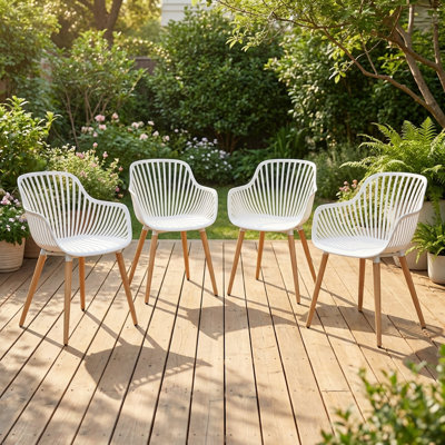Set of 4 Modern Dining Chairs, All-Weather Plastic Patio Chairs with Iron Legs, 330 LBS Capacity Ergonomic Kitchen Chairs for Indoor/Outdoor Use, White