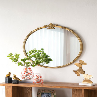 Gold Finish Round Wall Accent Mirror With Decorative Leaf Crest