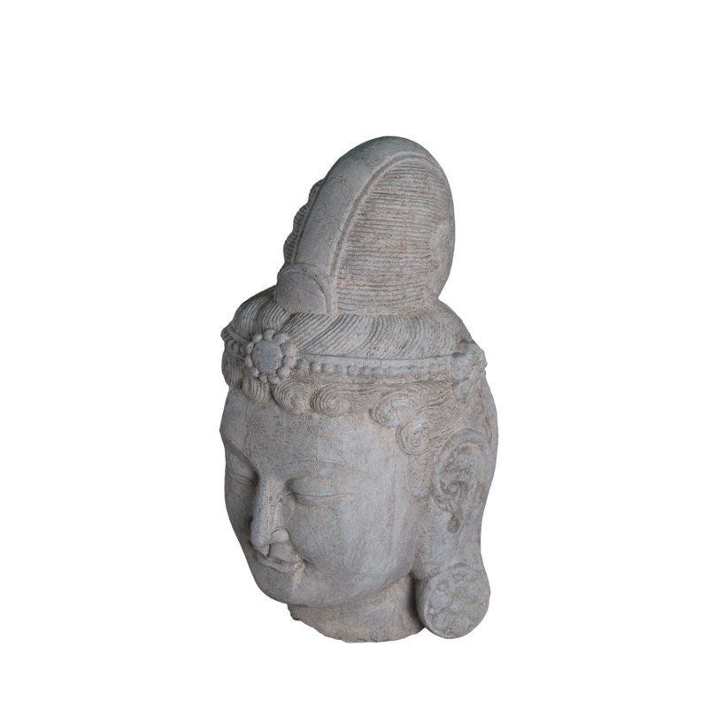 A Stone Statue Of Guanyin Head