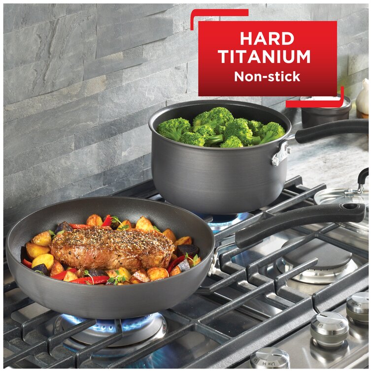 https://assets.wfcdn.com/im/54143122/resize-h755-w755%5Ecompr-r85/1361/136115600/T-fal+Ultimate+Hard+Anodized+Aluminum+Nonstick+Cookware+Set%2C+12+piece%2C+Gray+with+Red+handles.jpg