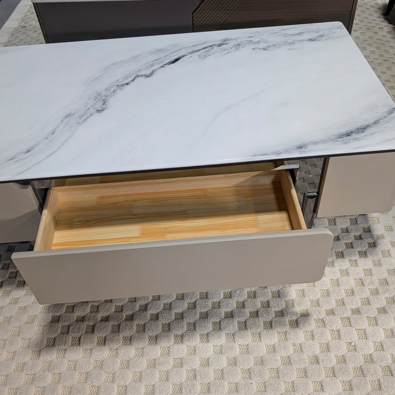 Table basse avec pierre veinée et tiroir à fermeture en douceur