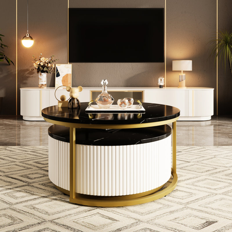 Table basse gigogne élégante à cannelures rondes - finition noire et dorée et fonction à la mode peu encombrante avec tiroir