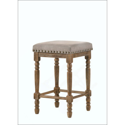 Ensemble de tabourets en tissu et à hauteur de comptoir, alliant confort et élégance rustique pour les cuisines et les bars modernes
