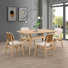 Ensemble de salle à manger 5 pièces en bois Aria avec pieds sculptés et chaises rembourrées